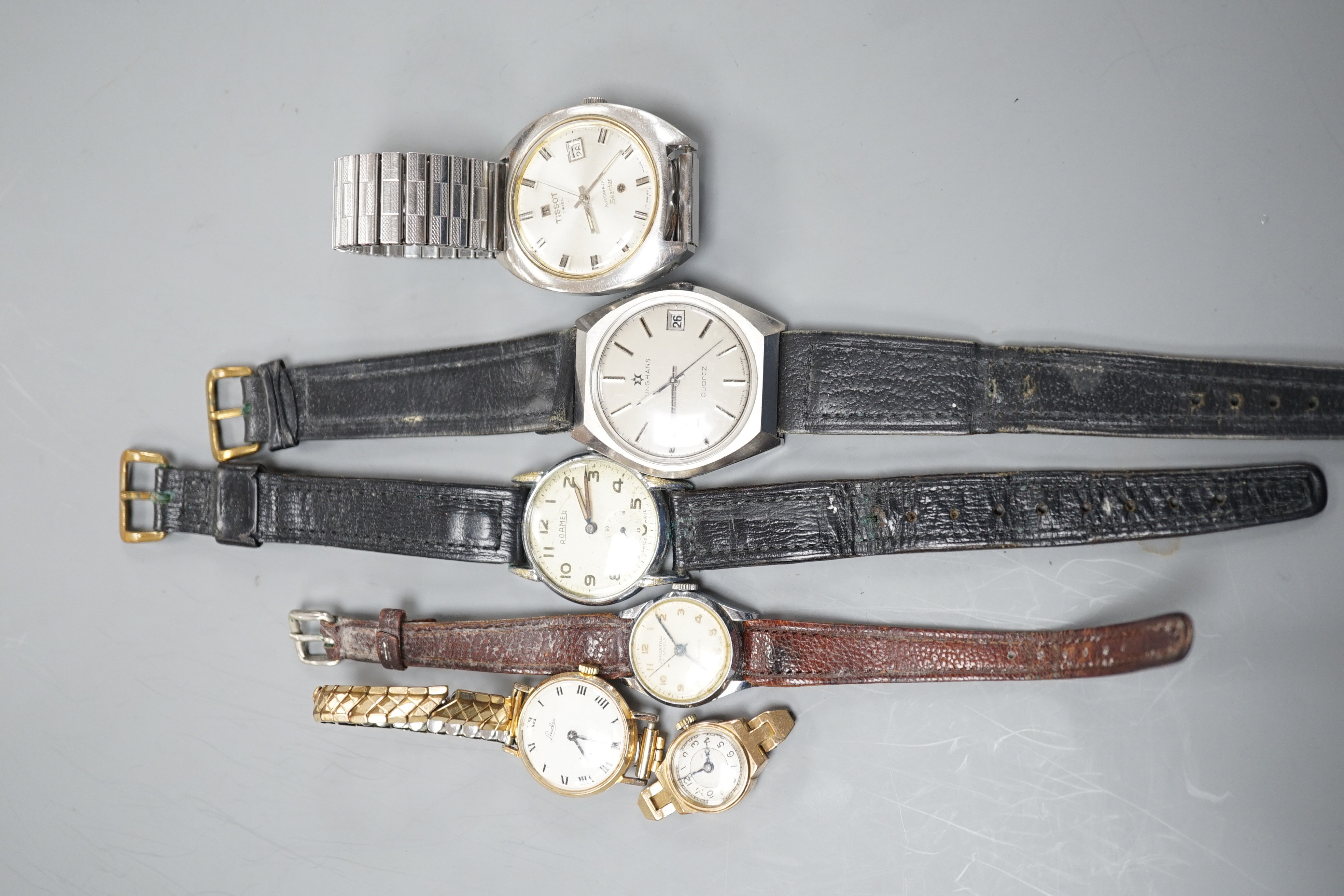 Three assorted gentleman's wrist watches including Junghans quartz, Roamer and Tissot and three lady's watches including Ingersoll and 9ct gold without strap.